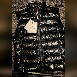 New with tags.  Moncler Shiny Puffer Black vest.  Size 4.